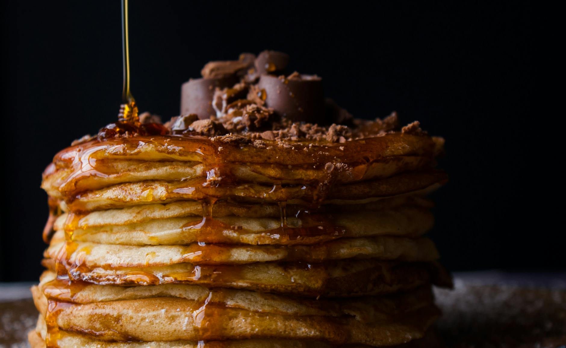 pile of pancake with honey